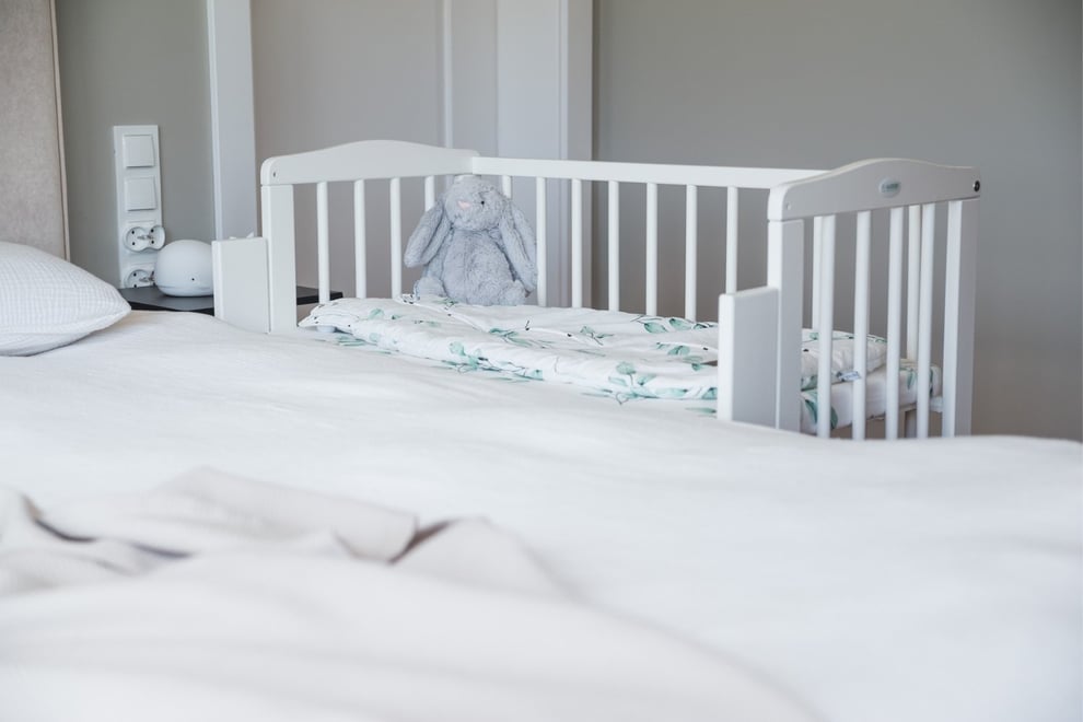 White Bedside Crib with Mattress and Bed Bumper