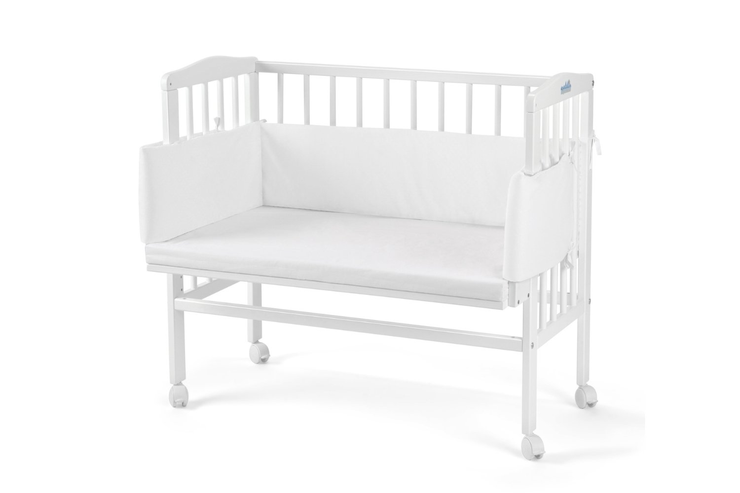 White Bedside Crib with Mattress and Bed Bumper