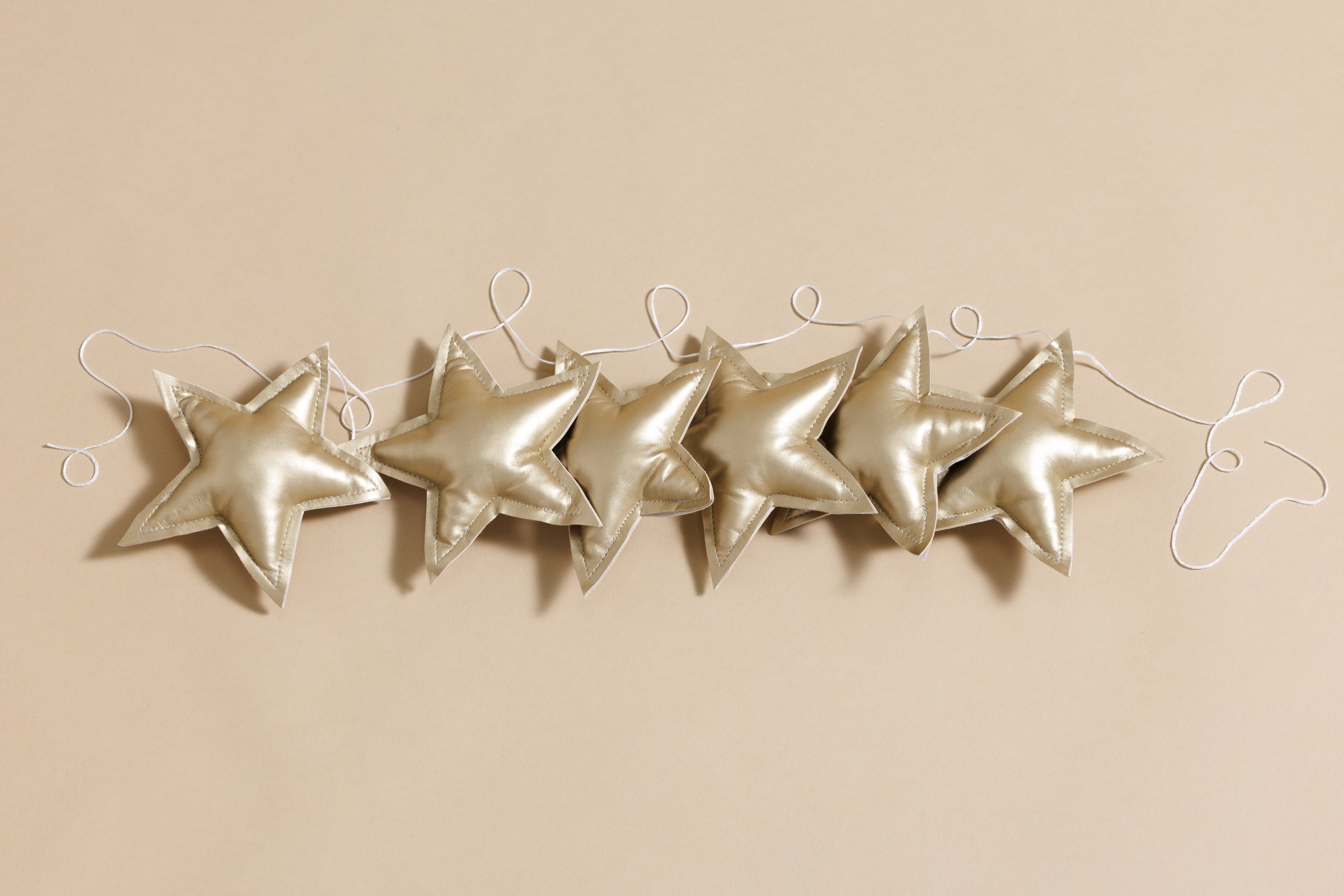 Ghirlanda di Stelle in Pelle Ecologica - Oro Ghirlanda di Stelle in Pelle Ecologica - Oro
